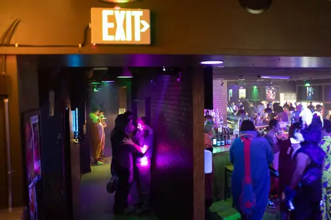 Late-night dance floor under club lights, photo by Beefshanks